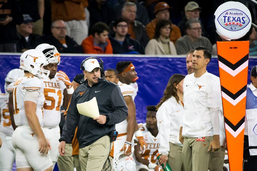Texas head coach Tom Herman paces the sideline during the first quarter of the Texas Bowl...