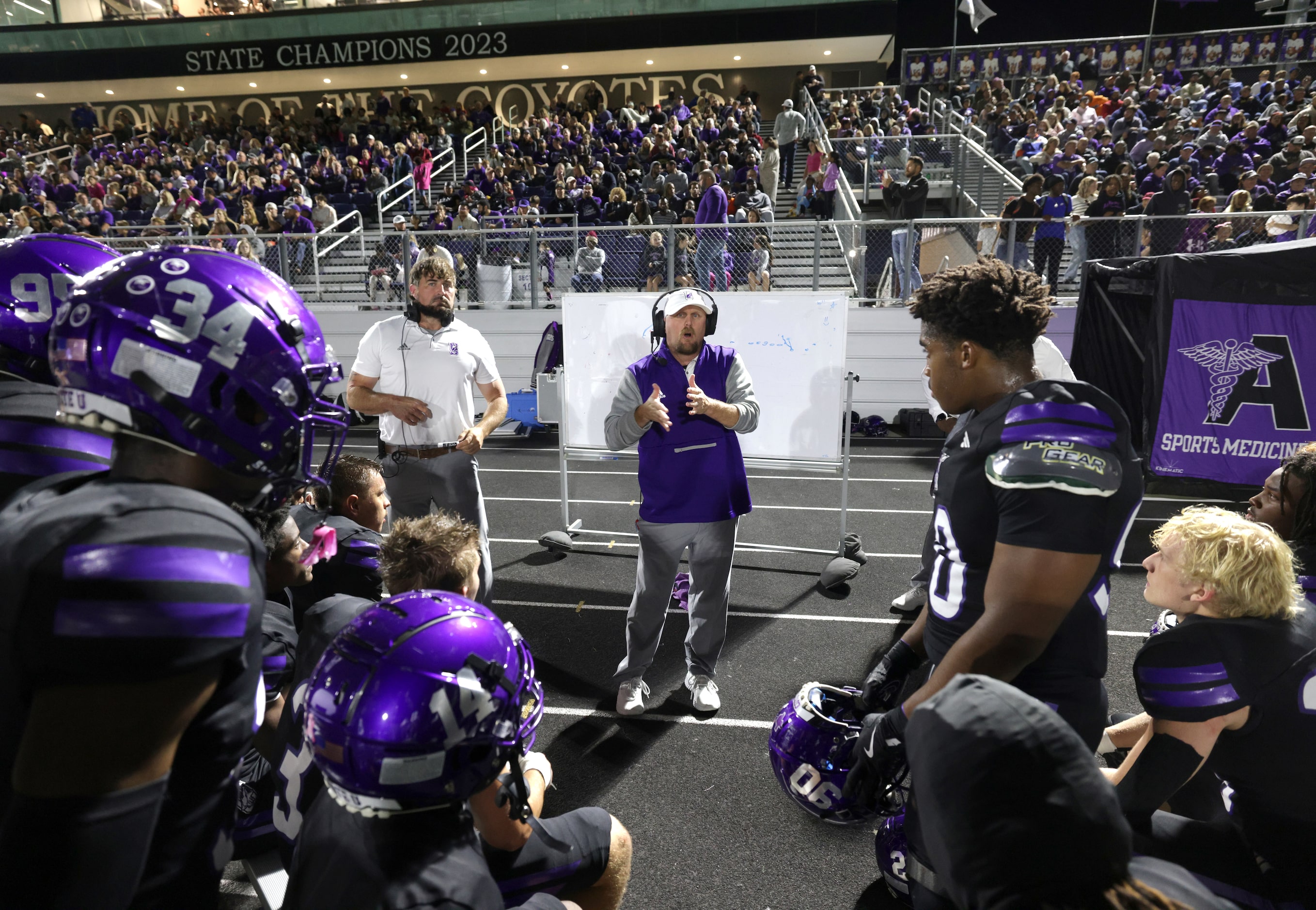 The Anna team discusses their gameplan during the Prosper Walnut Grove High School versus...