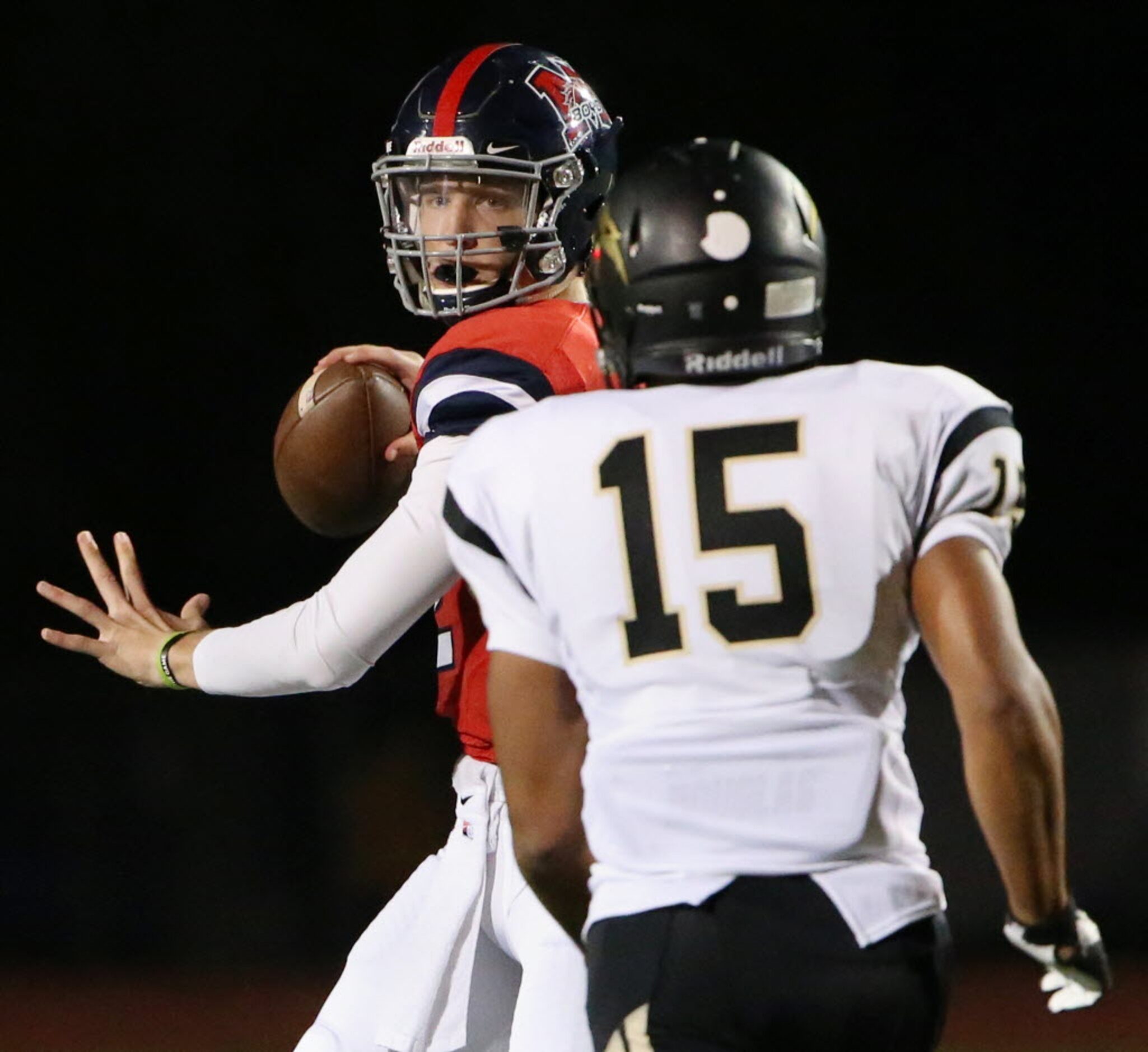 Plano East linebacker Christian Buchanan puts pressure on McKinney Boyd quarterback Grant...