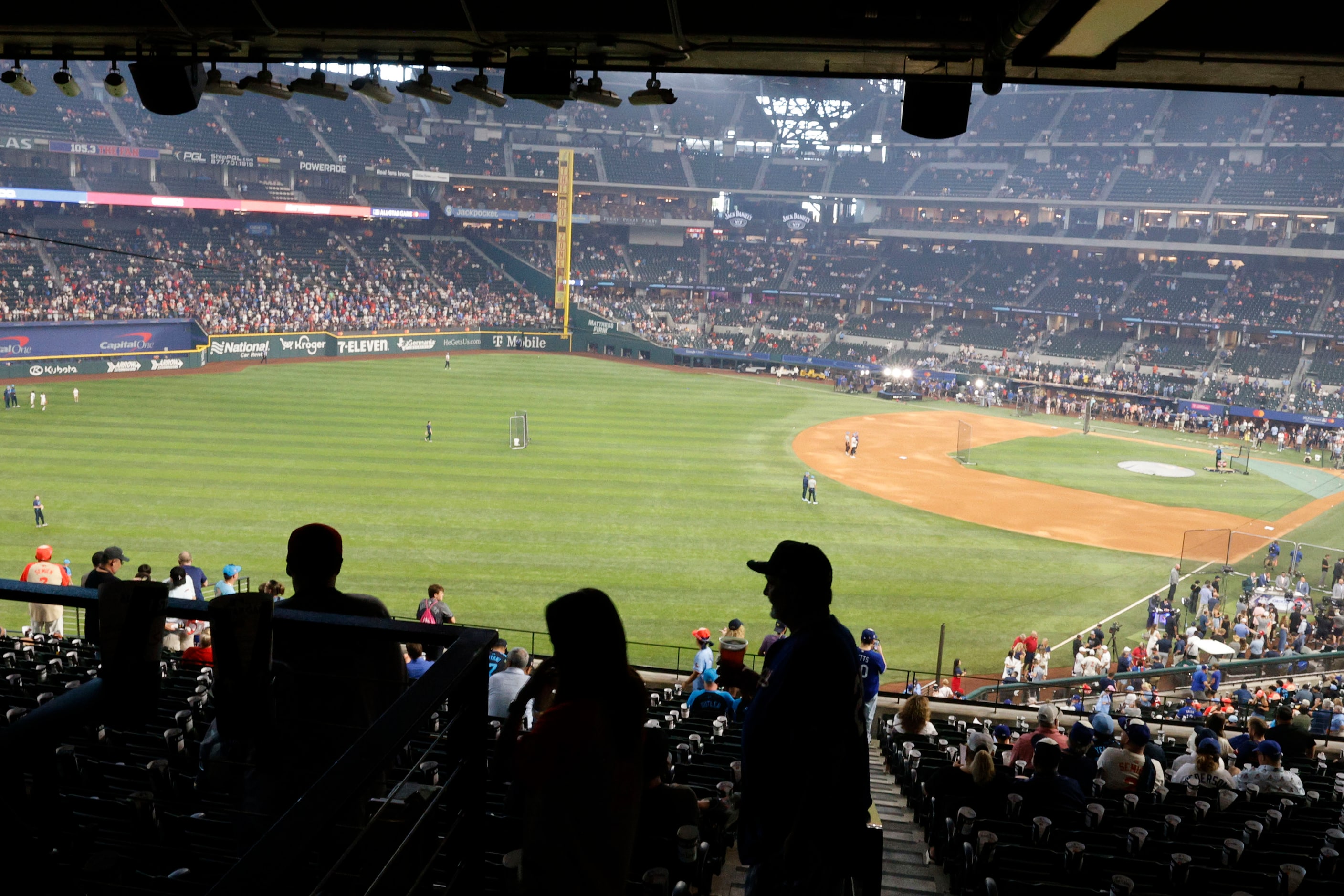 Fans arrive at Globe Life Field, Tuesday, July 16, 2024, in Arlington, before the MLB...