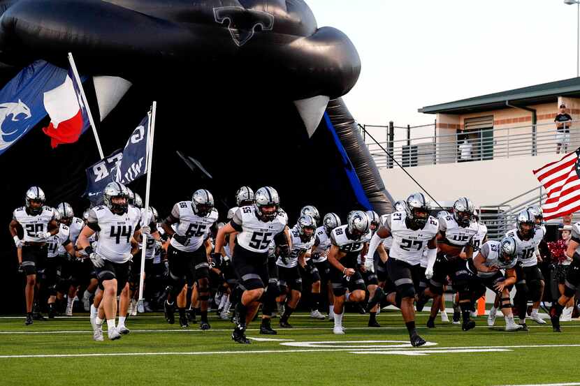 The Denton Guyer Wildcats enter the field to face Denton Braswell in a District 5-6A high...