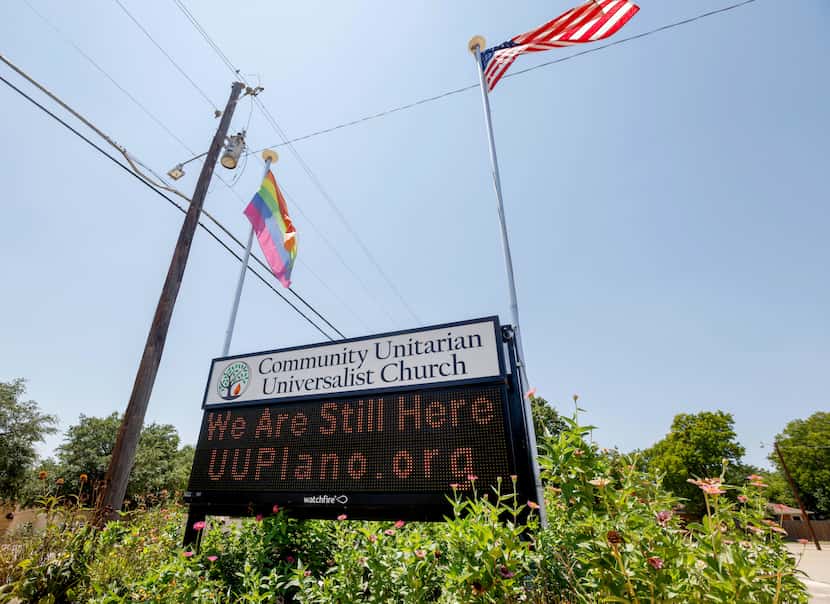 A digital sign outside of the Community Unitarian Universalist Church of Plano says, “We Are...
