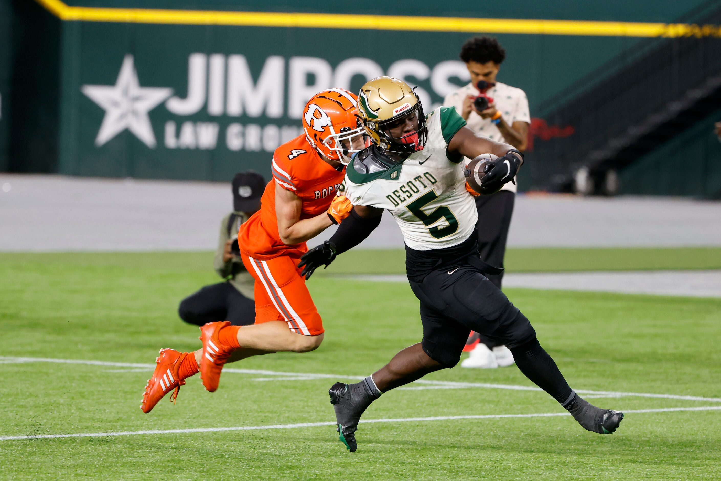 Desoto running back Christopher Henley Jr. scores a touchdown as Rockwall defender Tre...