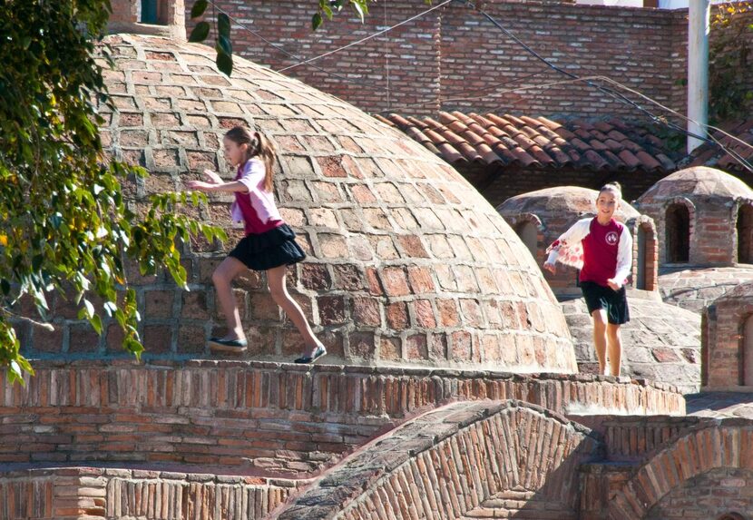 Girls play above Hammam in Tblisi