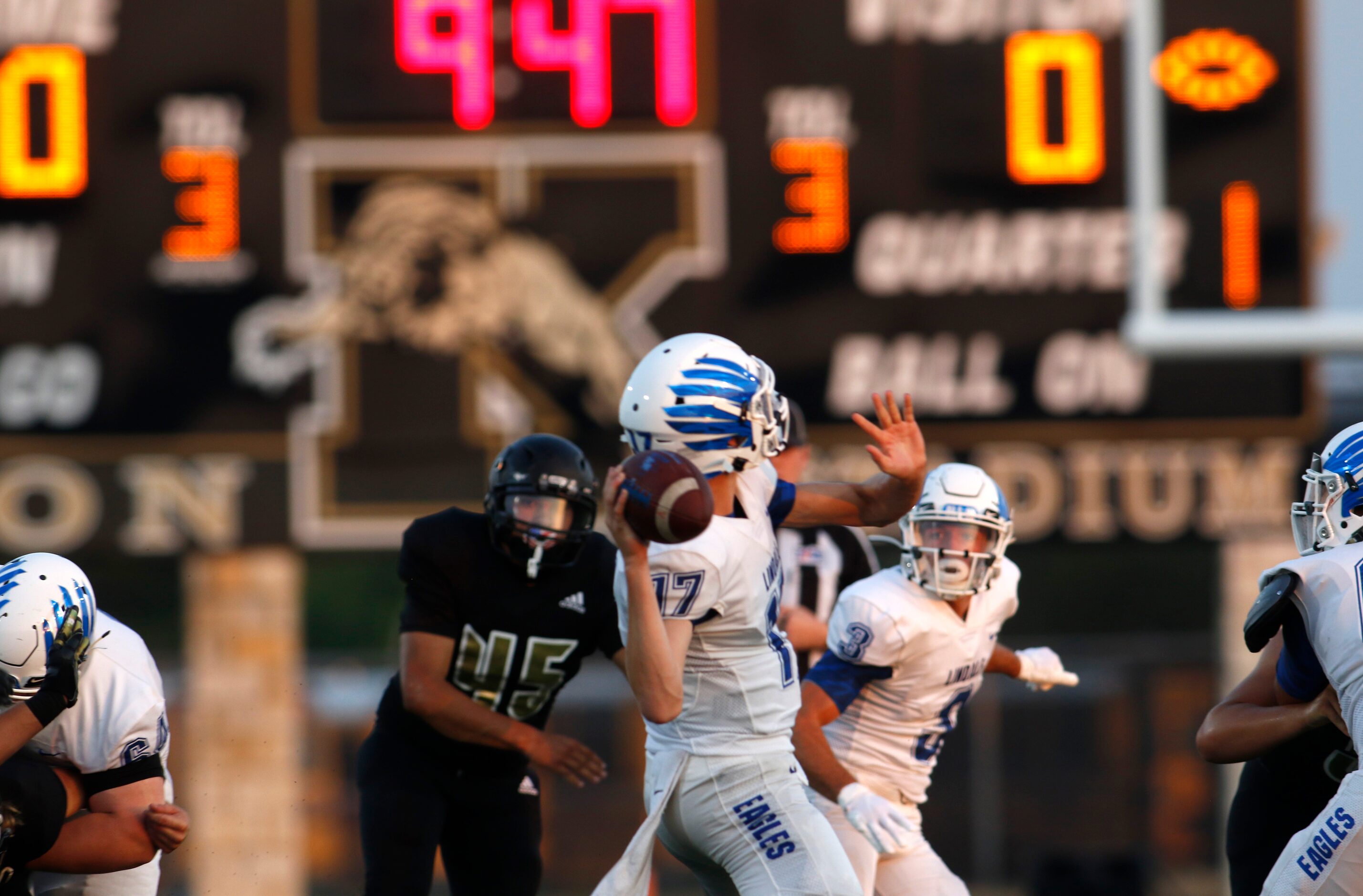 Lindale quarterback Sam Peterson (17) prepares to launch a long pass downfield during the...