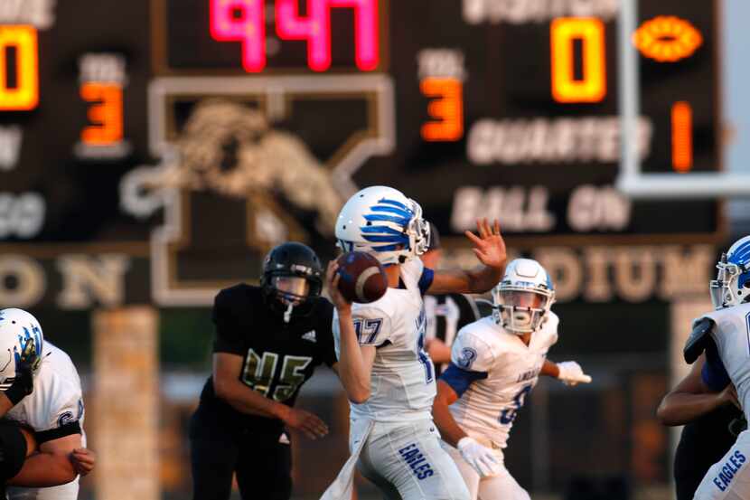 Lindale quarterback Sam Peterson (17) prepares to launch a long pass downfield during the...