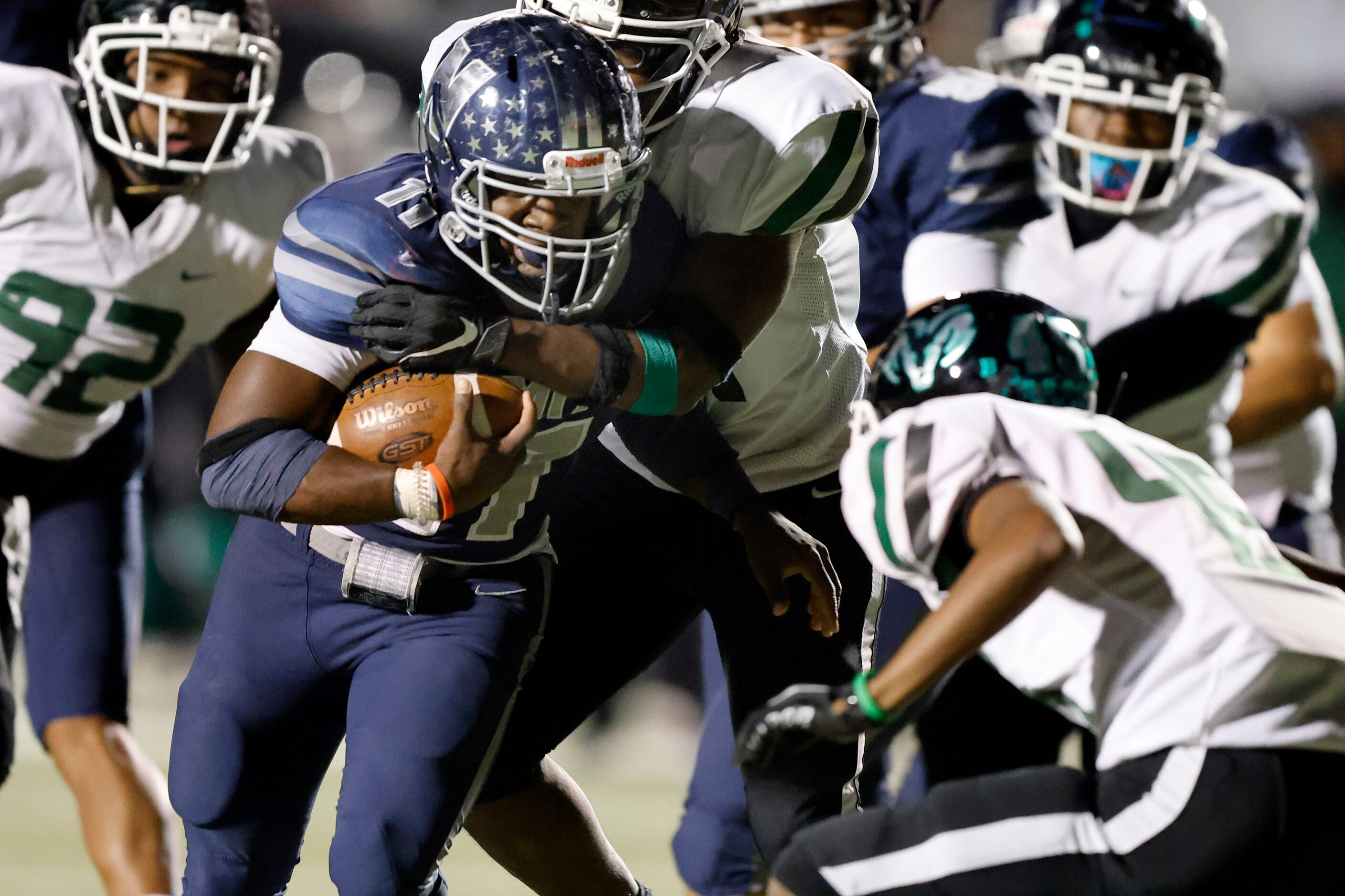 Irving Nimitz running back J'den Hall (11) carries the ball against the Richardson Berkner...