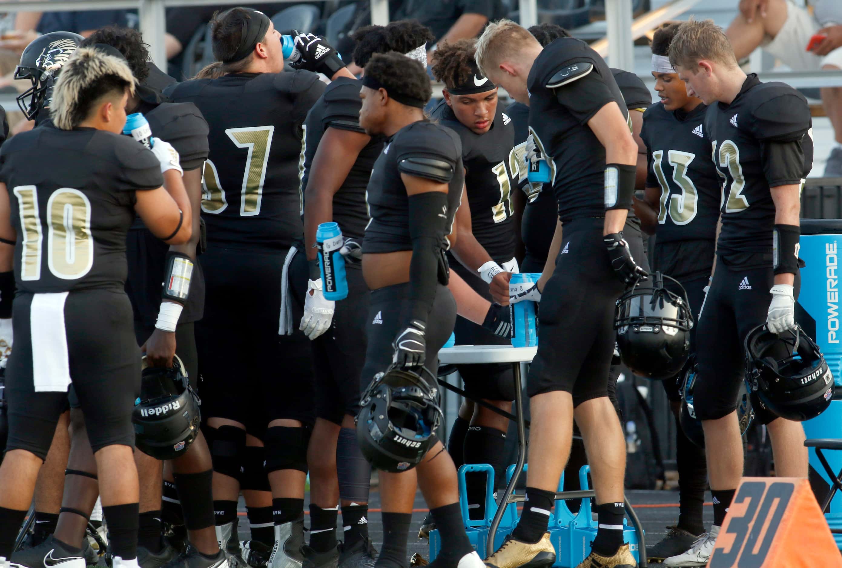 With the game time temperature hovering around the century mark, Kaufman players hydrate...
