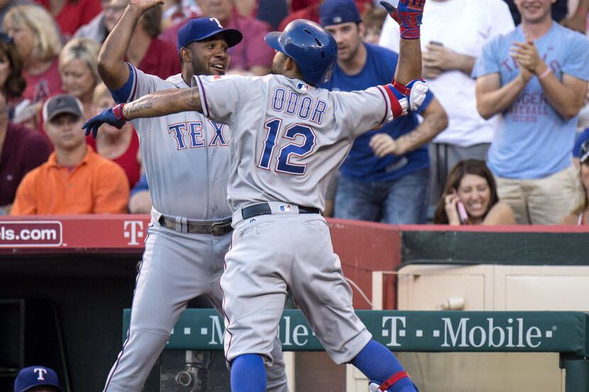 Texas Rangers' Elvis Andrus, left, and Rougned Odor celebrate Odor's two-run homer in the...