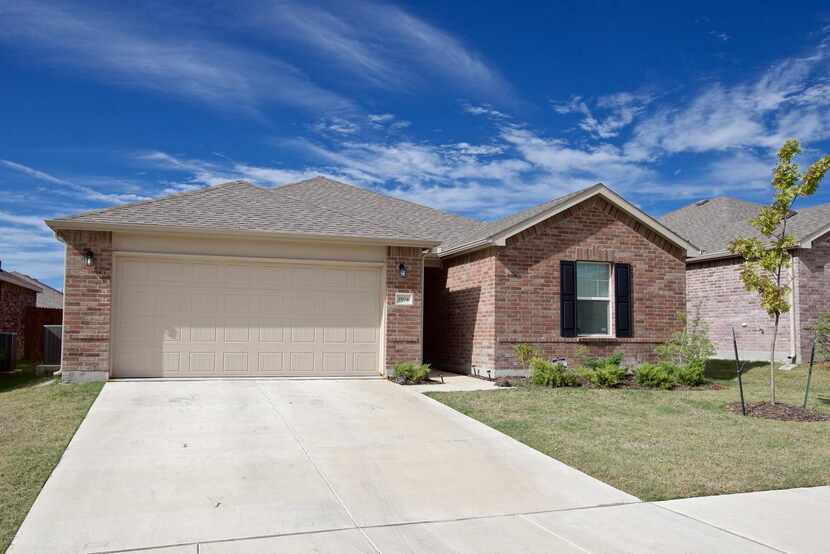 
The front of the 1,641 sqft "Rosemont" floor plan Centex house in the Paloma Creek South...
