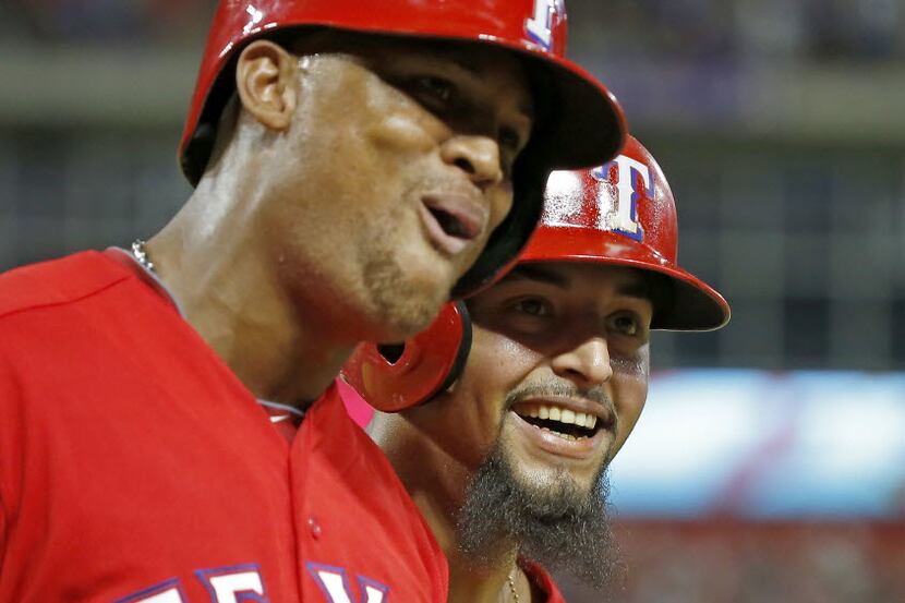 Texas Rangers third baseman Adrian Beltre (29) and second baseman Rougned Odor celebrate...