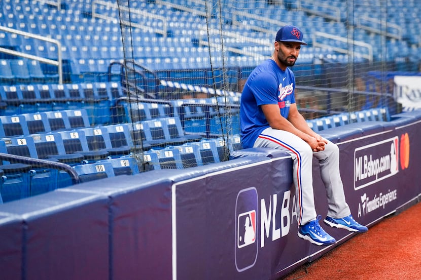 Texas Rangers second baseman Marcus Semien looks out on the field  before an American League...