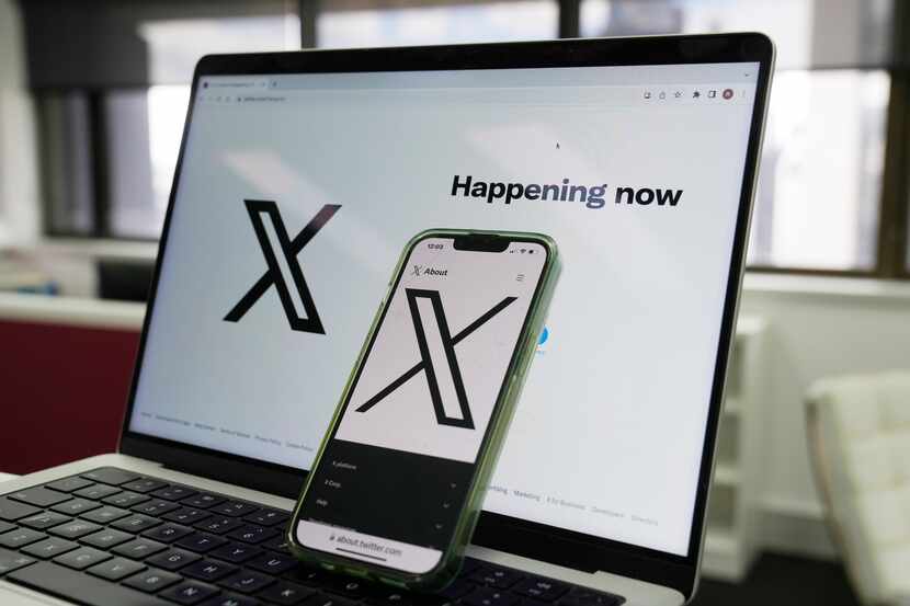 FILE - The opening page of X is displayed on a computer and phone in Sydney on Oct. 16,...