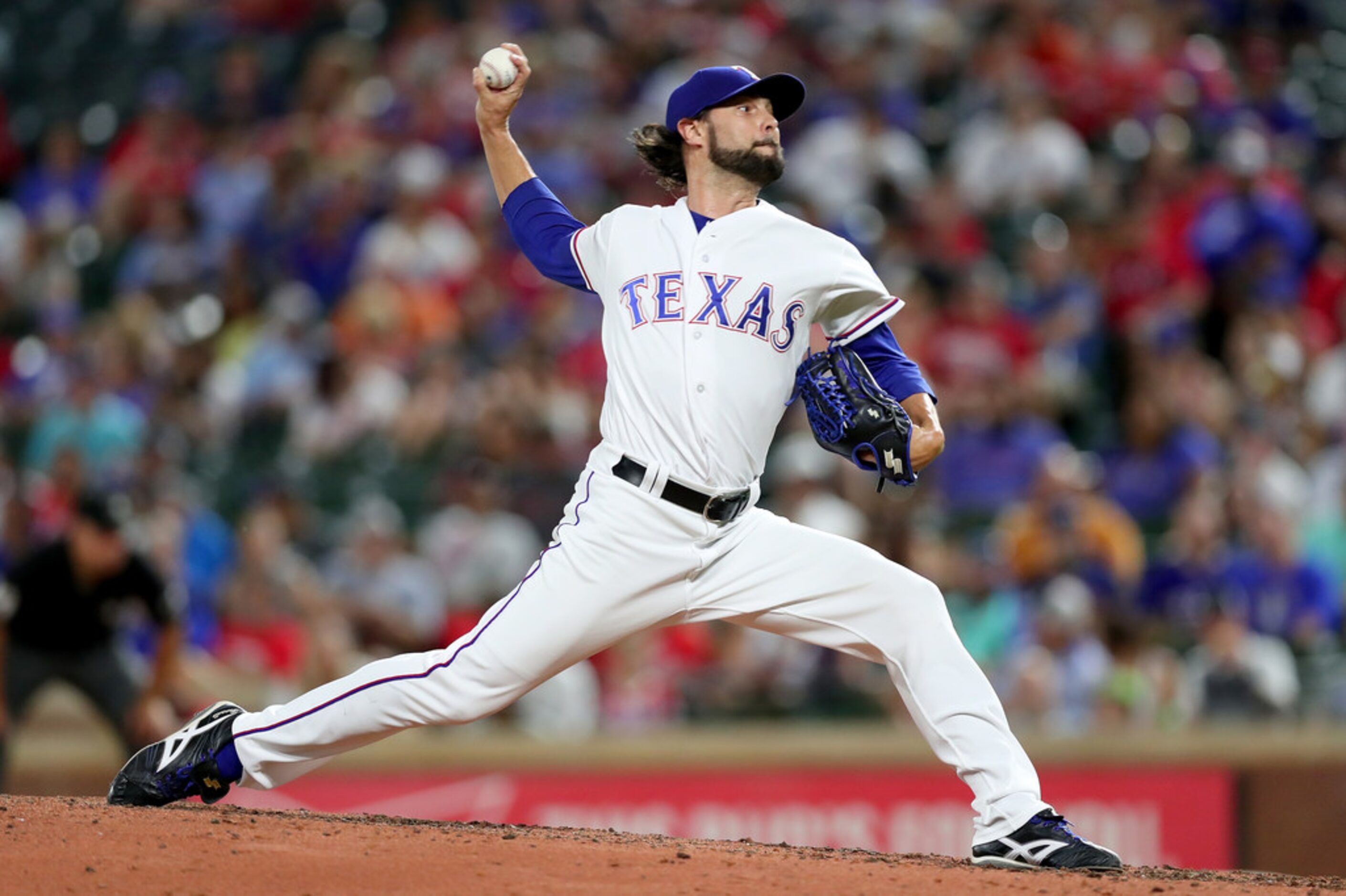 ARLINGTON, TX - JUNE 25:  Tony Barnette #43 of the Texas Rangers pitches against the San...