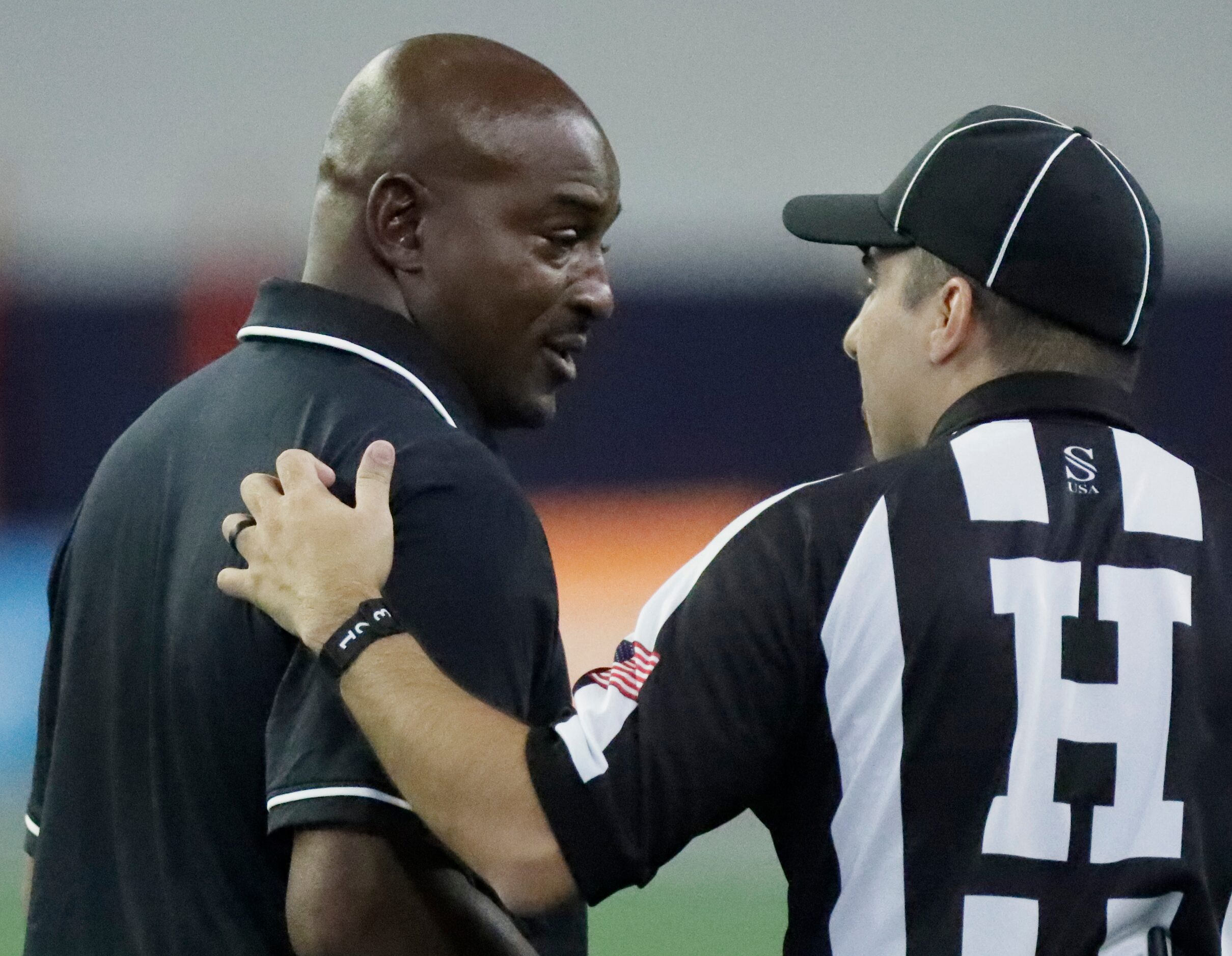 Cedar Hill High School head coach Nick Ward asks for an explanation of a call during the...