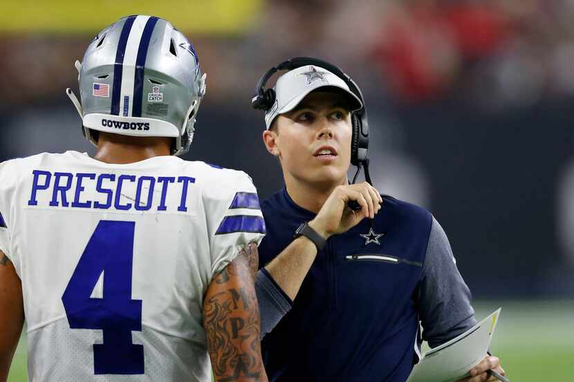 FILE - Cowboys assistant Kellen Moore talks to quarterback Dak Prescott (4)  during the...