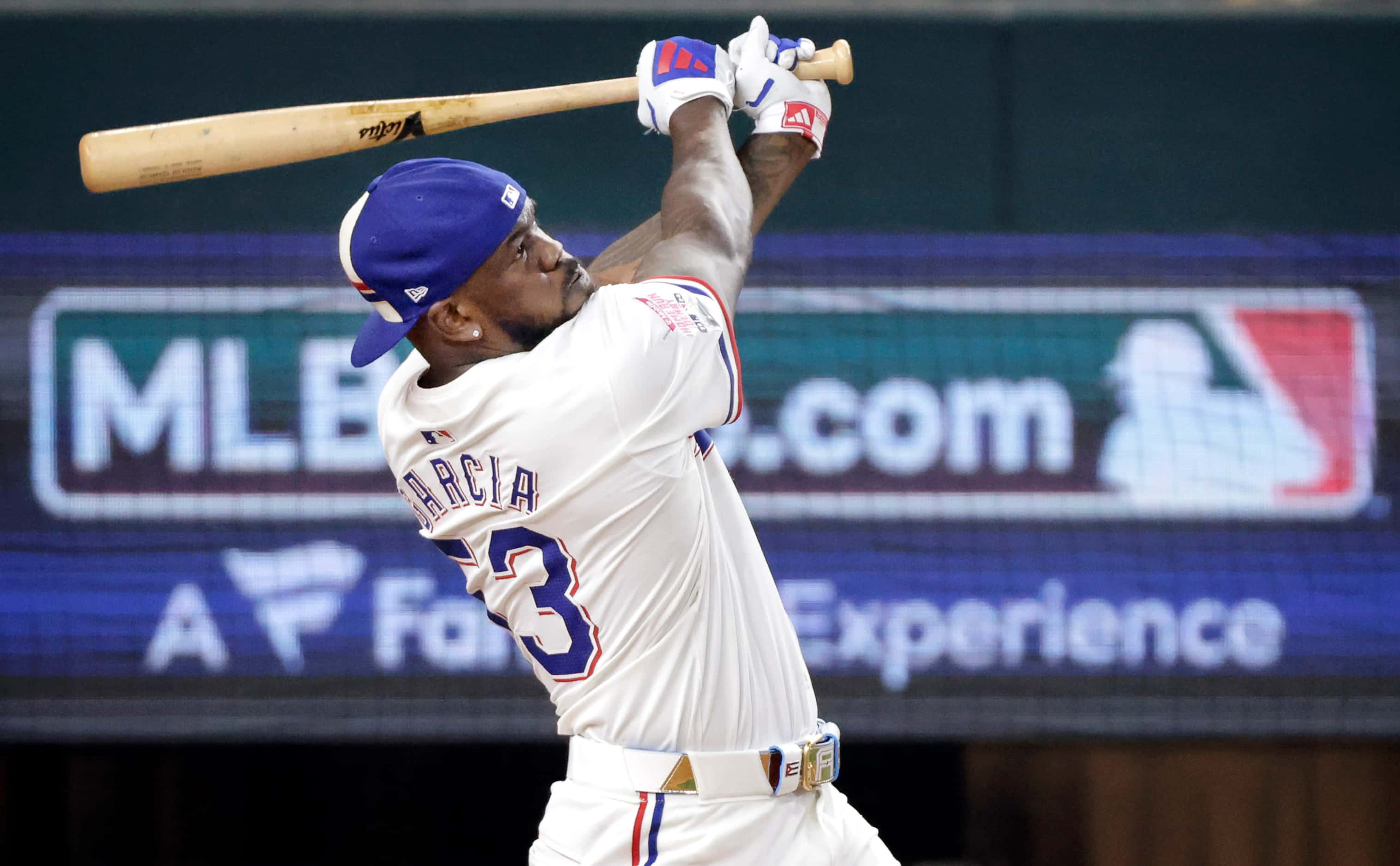 Texas Rangers outfielder Adolis Garcia connects on a first round home run in the MLB...