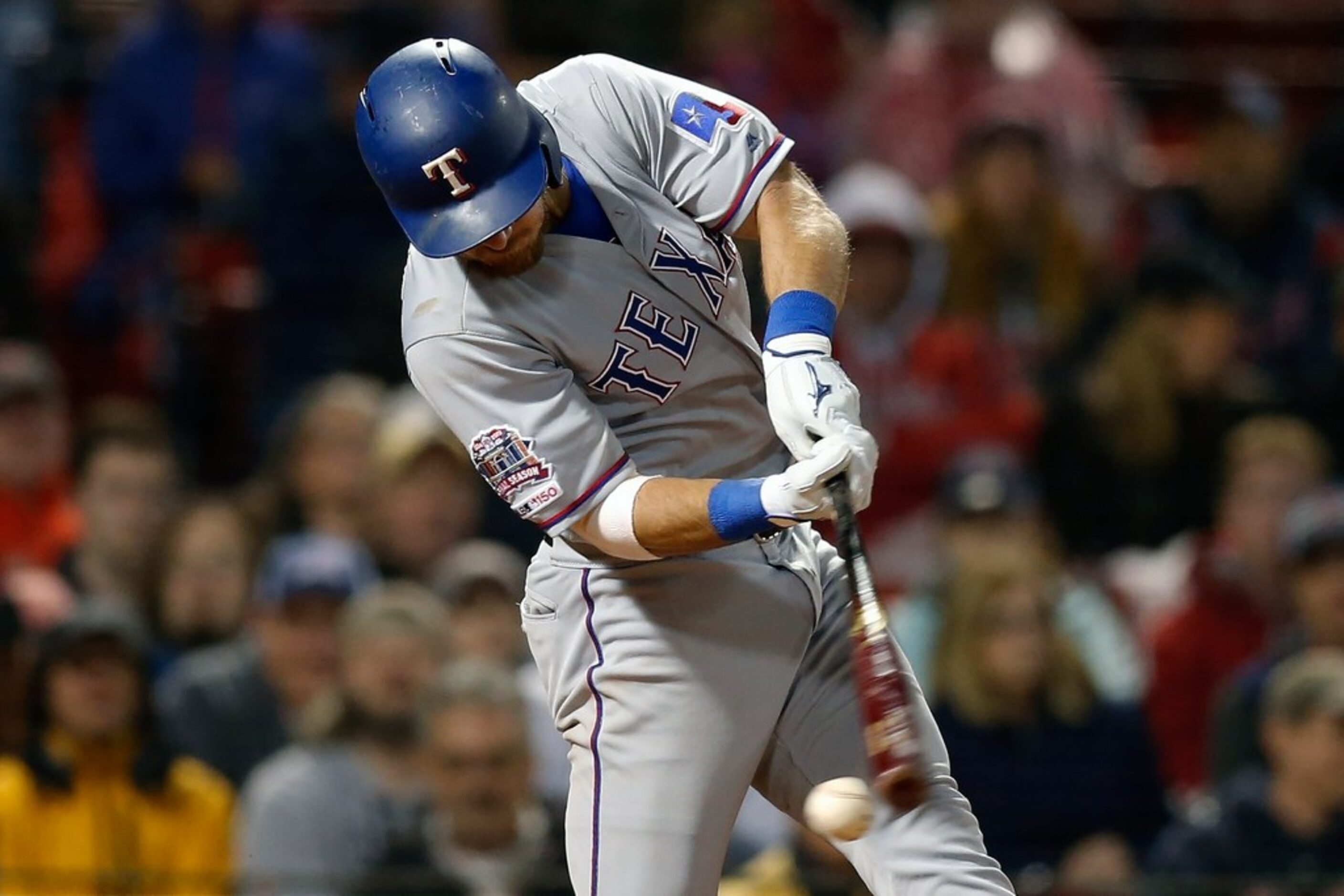 Texas Rangers' Jeff Mathis strikes out on a foul tip during the seventh inning of a baseball...