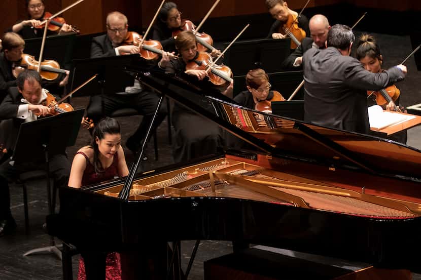 Pianist Joyce Yang plays while conductor Miguel Harth-Beyodya leads the Fort Worth Symphony...