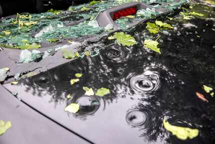 A vehicle sustained significant window damage and dents in a severe hailstorm overnight in...