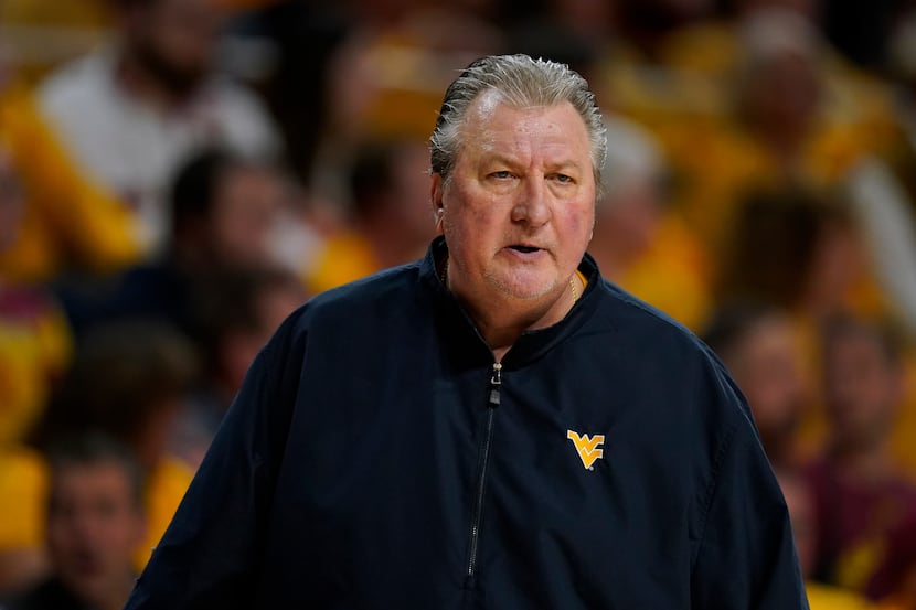 West Virginia head coach Bob Huggins watches from the bench during the first half of an NCAA...