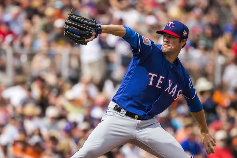 Texas Rangers pitcher Cole Hamels pitches during the second inning against the San Francisco...