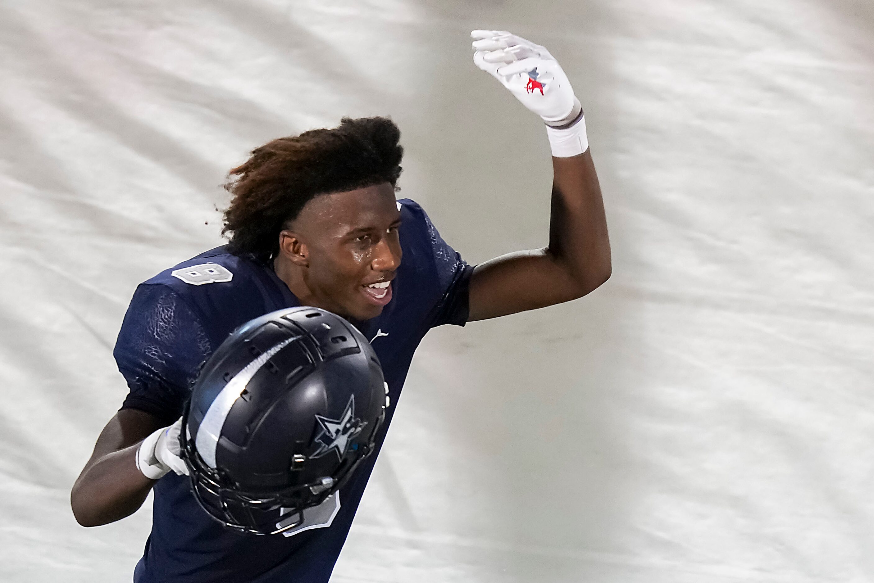 Frisco Lone Star wide receiver Winston Pollard celebrates after scoring on a 42-yard...