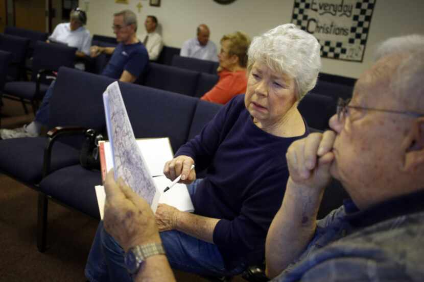 Sharon Carlton and Ron Morgan looked over a map during a meeting Wednesday at First United...