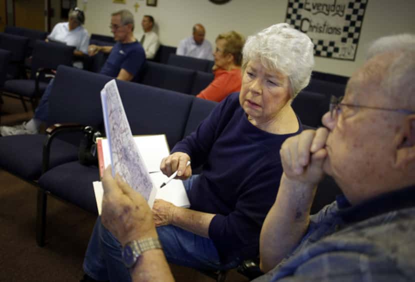 Sharon Carlton and Ron Morgan looked over a map during a meeting Wednesday at First United...