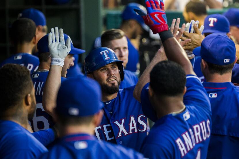Texas Rangers catcher Bobby Wilson (6) celebrates a home run with his teammates during the...