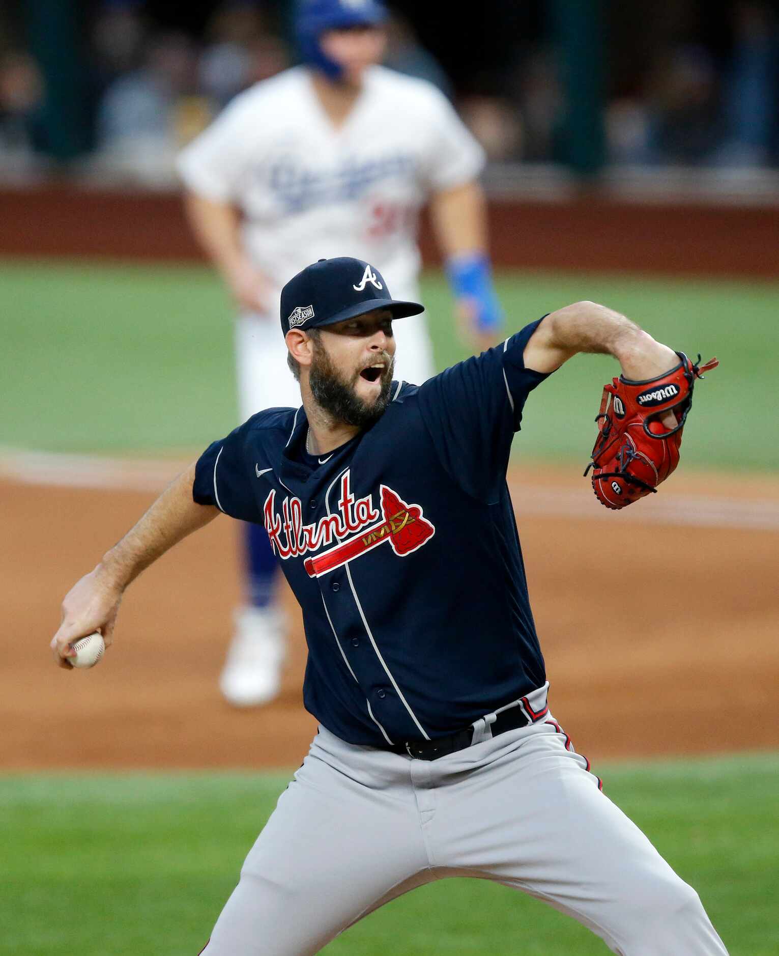 Atlanta Braves relief pitcher Chris Martin (55) throws against the Los Angeles Dodgers...