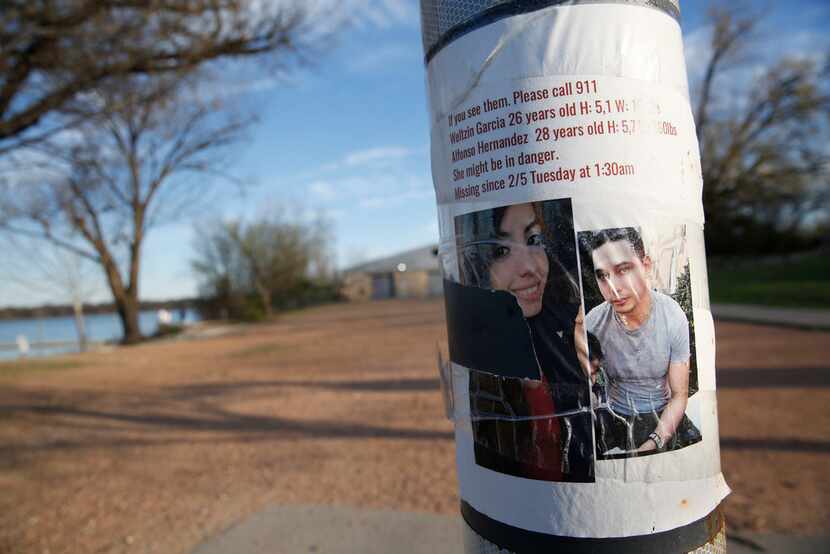 A missing persons flyer for Weltzin Garcia Mireles and Alfonso Hernandez is seen at White...