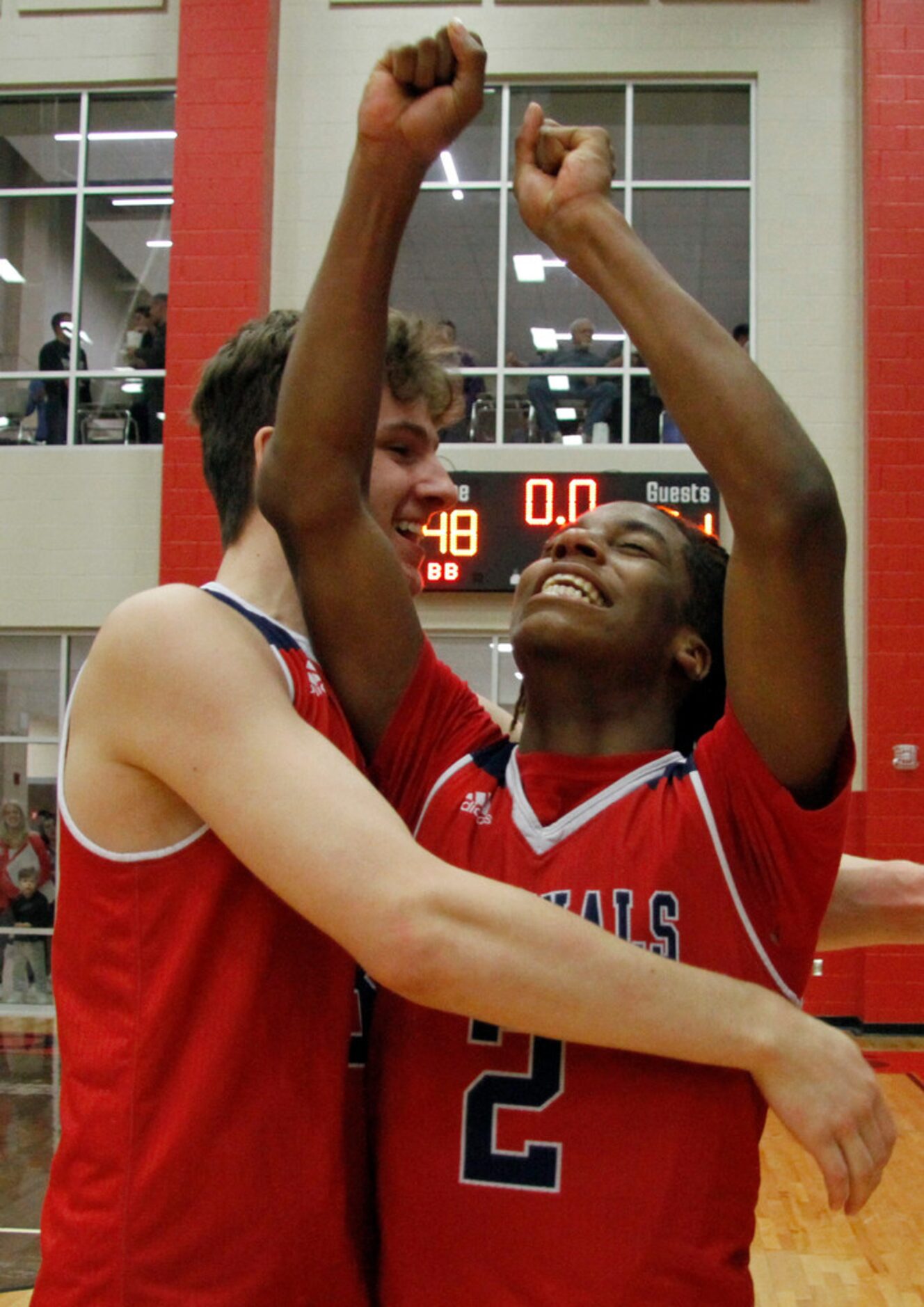 Plano John Paul ll teammates Jalen Tot (2) and Nicholas Kendall (31) were in a state of...