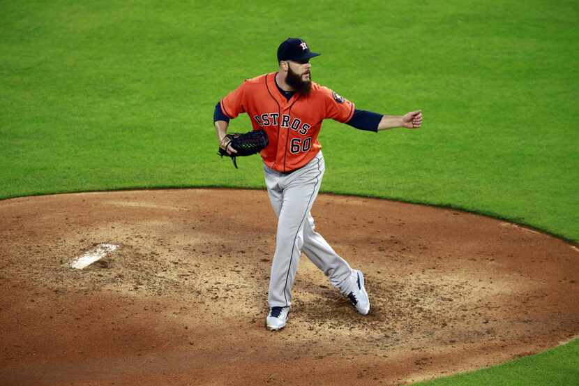 Houston Astros starting pitcher Dallas Keuchel (60) follows through on a pitch against the...