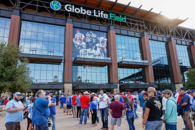 Fans wait to enter the ballpark before Game 3 of the American League Championship Series...