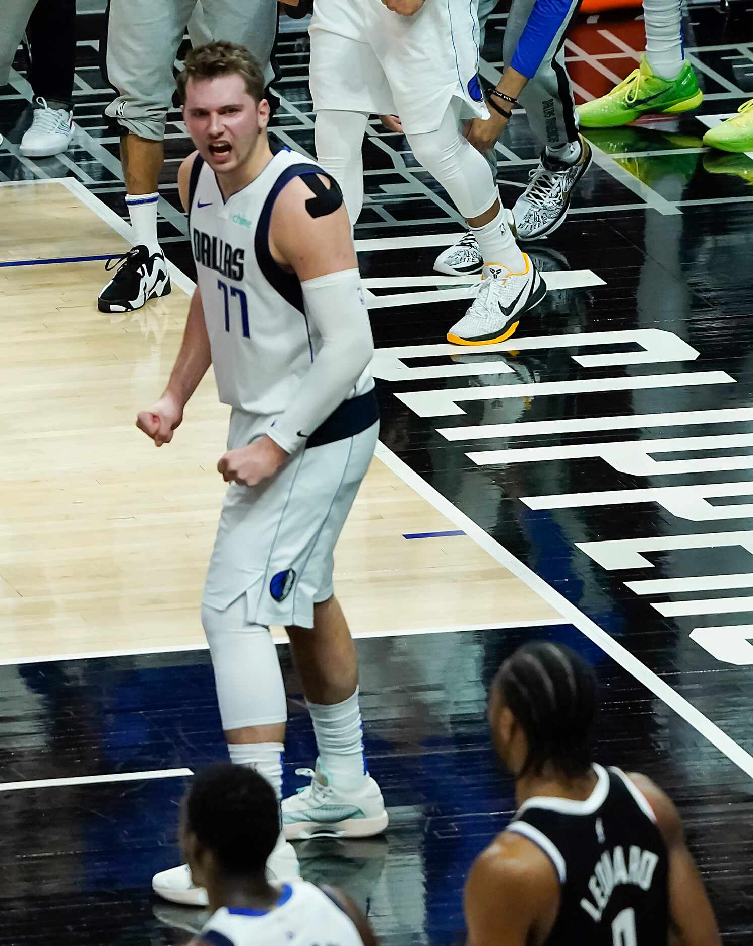 Dallas Mavericks guard Luka Doncic celebrates after LA Clippers forward Kawhi Leonard (2)...