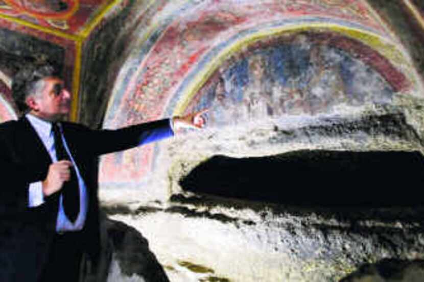 Fabrizio Bisconti, superintendent of archaeology for the catacombs, pointed out frescoes...