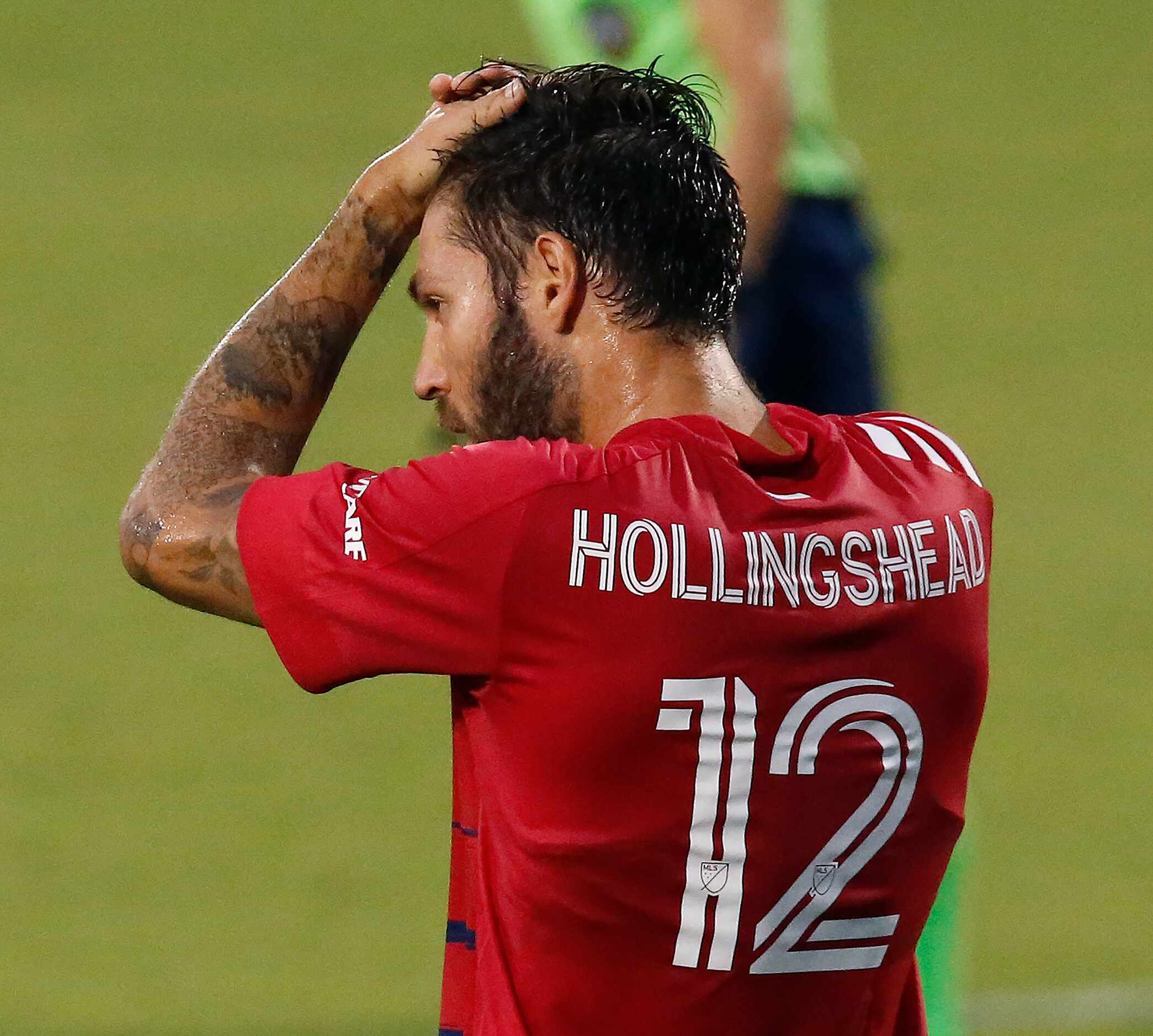 FC Dallas midfielder Ryan Hollingshead (12) reacts to a missed opportunity during the first...