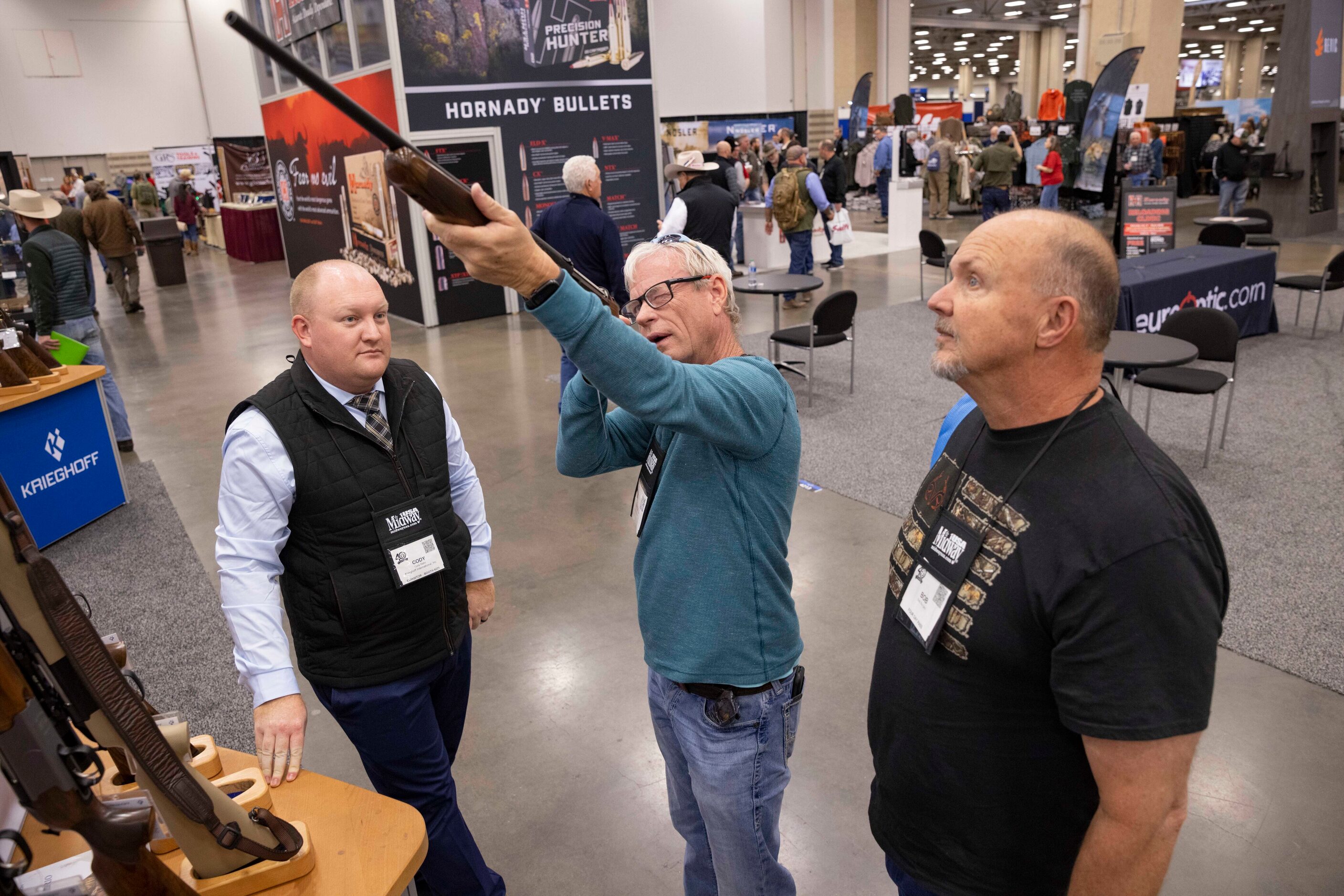 From left: Krieghoff International sales manager Cody Rahn watches as Randall Franklin and...