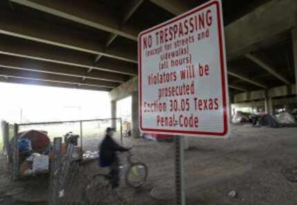  City work crews put up "No Trespassing" signs around Tent City this week. (Jae S. Lee/Staff...