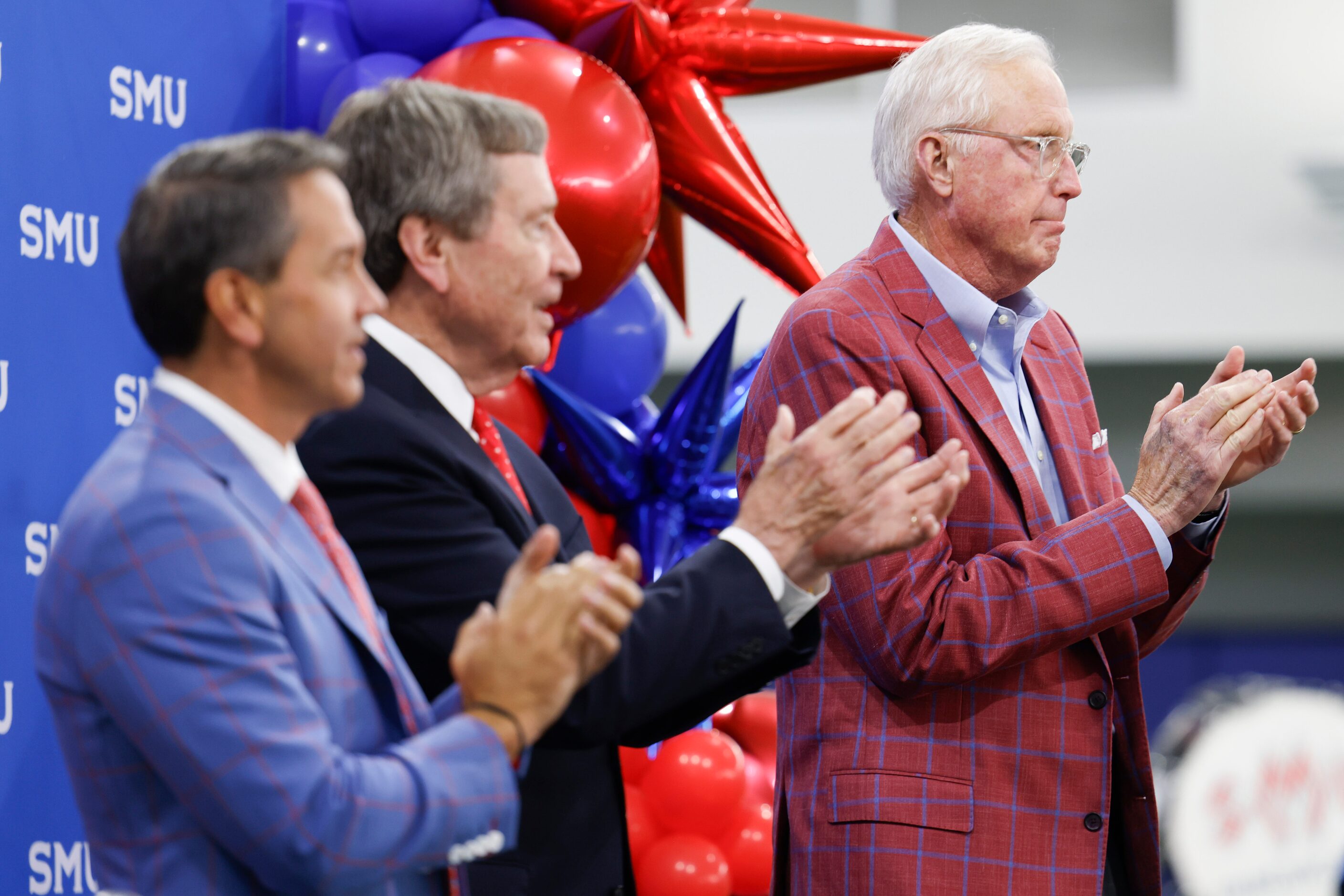 From left, SMU director of athletics Rick Hart, President R. Gerald Turner and board chair...