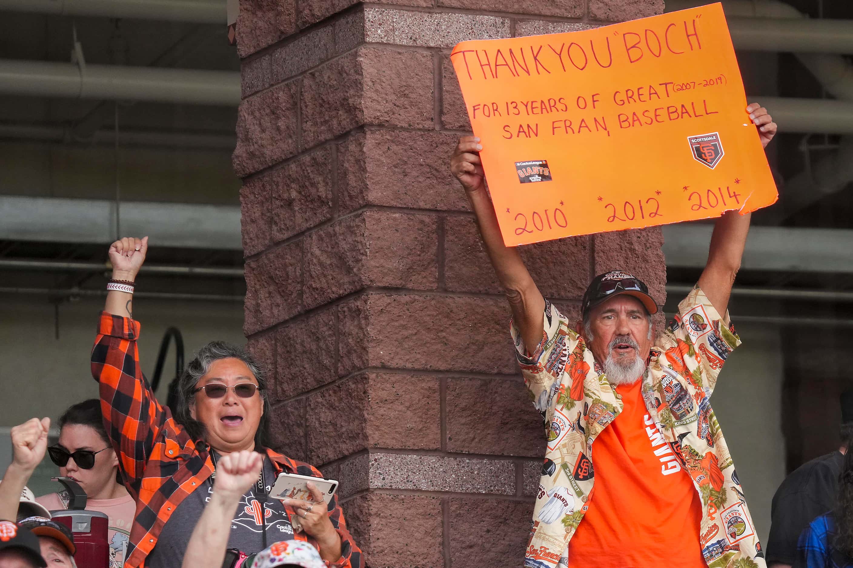 San Francisco Giants fans cheer Texas Rangers manager Bruce Bochy during ceremonies...