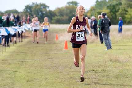 Plano senior Ashlyn Hillyard runs to victory in the Class 6A Region II girls race. (Jeffrey...