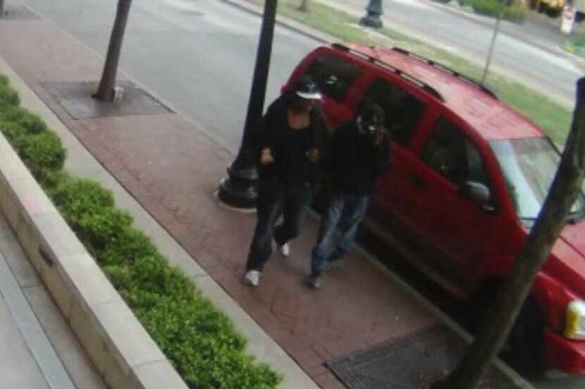  A surveillance image shows the suspects walking away from their Dodge Durango. (Dallas police)