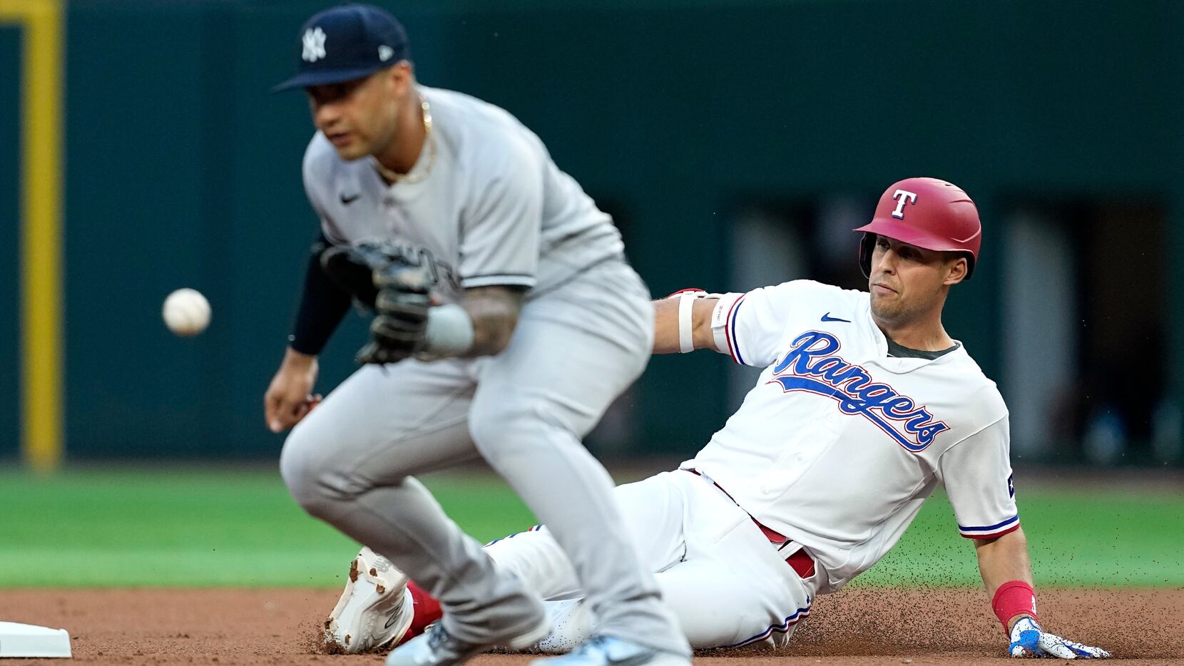 New York Yankees second baseman Gleyber Torres waits for the throw as Texas Rangers'...