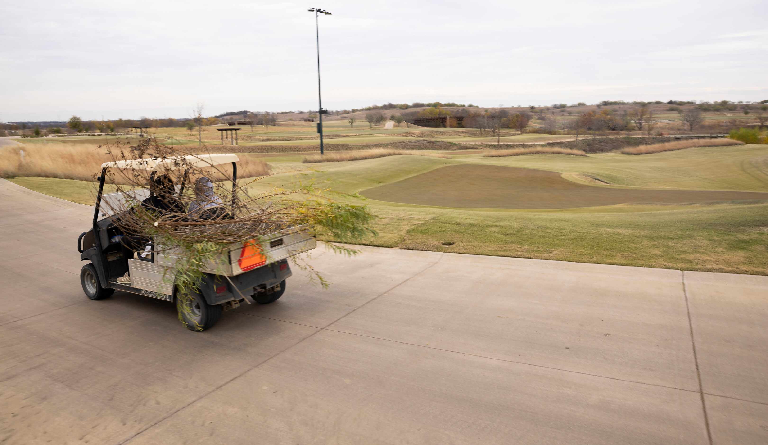 Field crews work on cleaning the resort's golf course. 