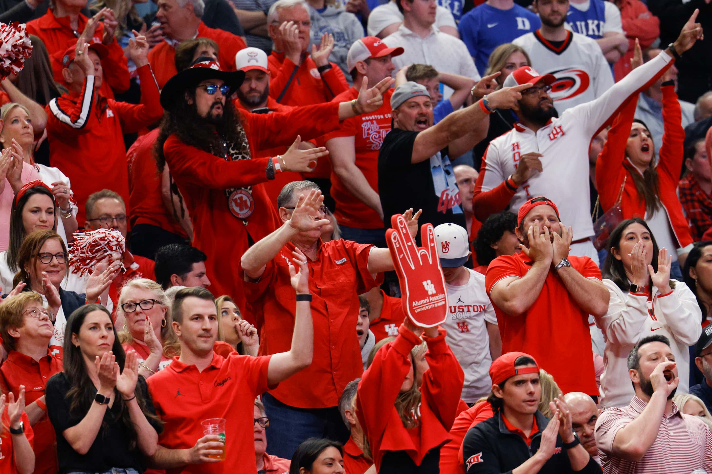 Houston fans cheer during the first half of an NCAA Men’s Sweet 16 basketball game against...