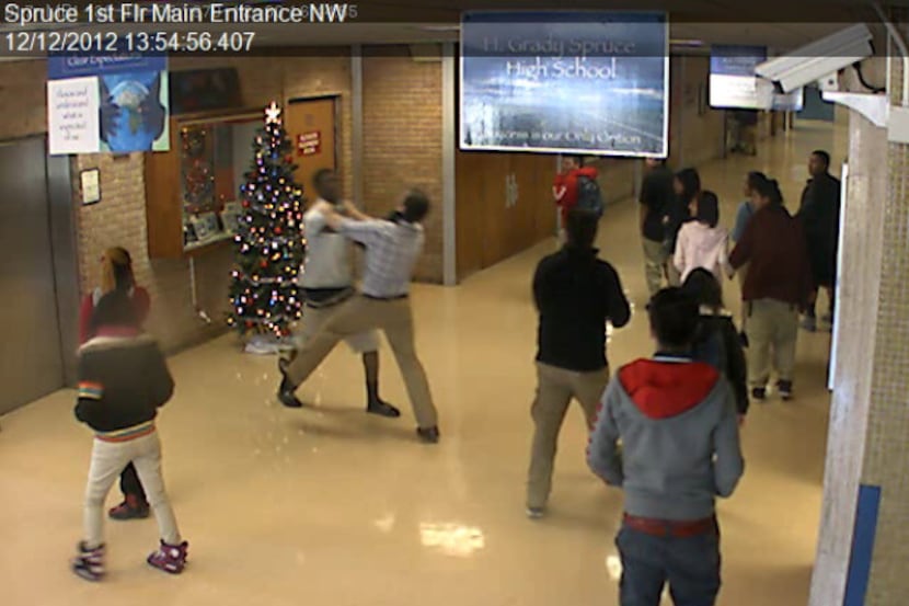A school surveillance video shows student Delvron Turner (top left) fighting with teacher...