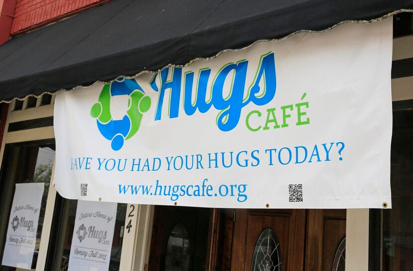 
A sign announces the fall opening of Hugs Café in downtown McKinney.
