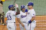 Texas Rangers first base Nathaniel Lowe (30) celebrates after hitting a home run with his...